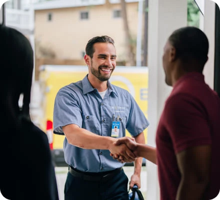 Service tech smiles at customer.